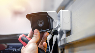 Technician installing a CCTV bullet camera