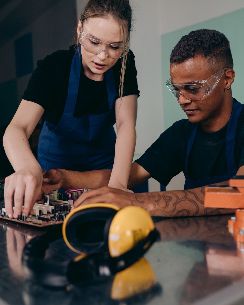 Engineers collaborating at a workbench