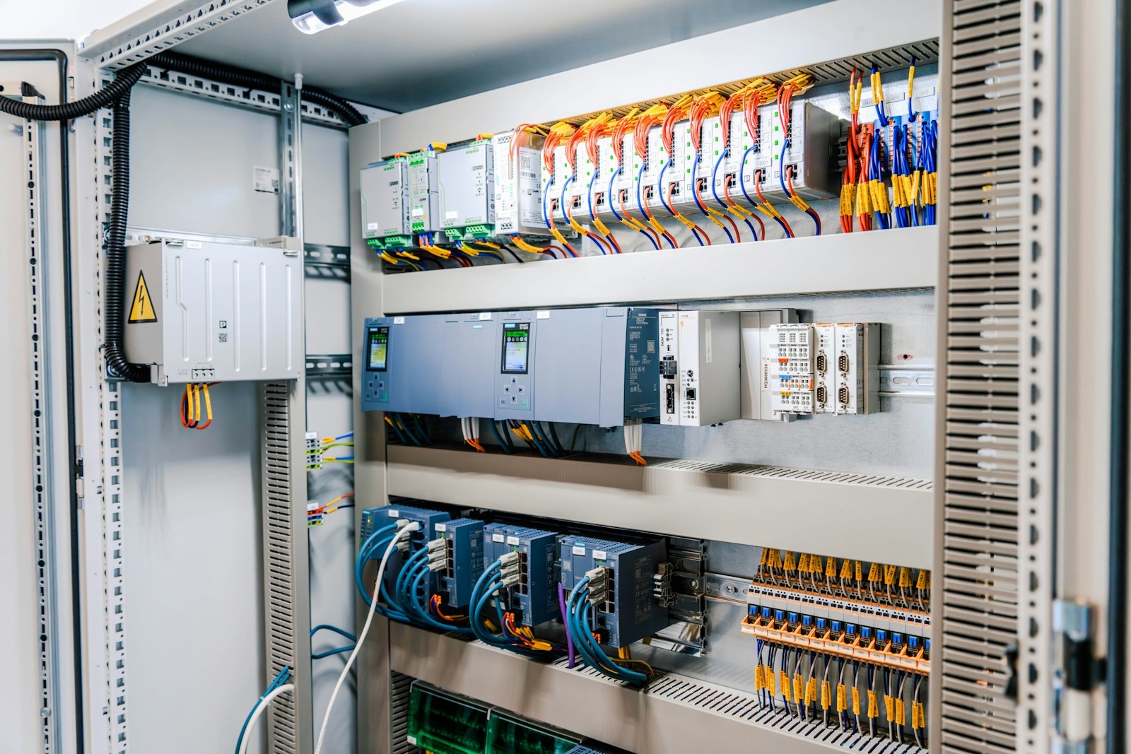Industrial automation control cabinet with PLC modules